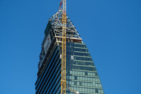 PwC tower Milan. Libeskind tower under construction. Milan. CityLife includes three skyscrapers and pedestrian areas with greenery. - MyVideoimage.com | Foto stock & Video footage