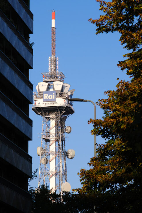 Radio antennas. Tower with antennas and TV radio repeaters of the RAI of Milan. Laterally buildings with residential houses. - MyVideoimage.com | Foto stock & Video footage