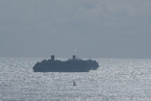 Reflections on the sea. Cruise ships in the distance anchored in the rough sea. Stock photos. - MyVideoimage.com | Foto stock & Video footage