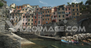 Riomaggiore footage video stock. Riomaggiore to the Cinque Terre. Colored houses on the sea.  Video footage.
