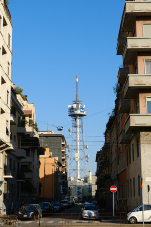 Ripetitori RAI di Milano. Tower with antennas and TV radio repeaters of the RAI of Milan. Laterally buildings with residential houses. - MyVideoimage.com | Foto stock & Video footage