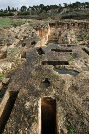 Rock tombs. Tombs in the Tuvixeddu necropolis. Stock photos. - MyVideoimage.com | Foto stock & Video footage