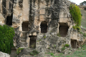 Rock tombs. Tombs in the Tuvixeddu necropolis. Stock photos. - MyVideoimage.com | Foto stock & Video footage