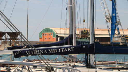 Sailboat of the Italian Navy anchored at the dock of the port of - MyVideoimage.com