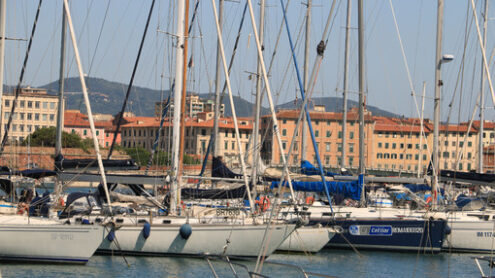 Sailboats anchored to the dock of the port. In the background th - MyVideoimage.com