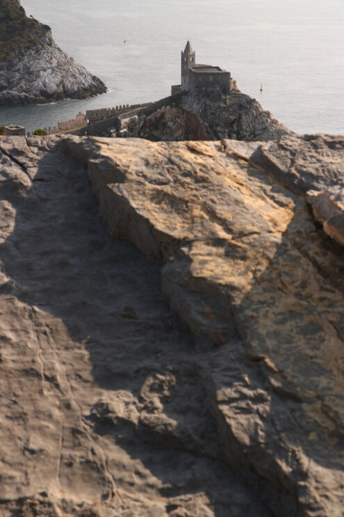 San Pietro Portovenere. Bell tower and church of San Pietro in Portovenere photographed from the street leading to the castle. - MyVideoimage.com | Foto stock & Video footage