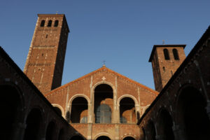 Sant’Ambrogio foto della chiesa. Milano. Detail of the facade of the church of Sant’Ambrogio in Milan built with red bricks. Milano foto. - MyVideoimage.com | Foto stock & Video footage