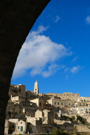 Sassi Matera Panorama Panorama of the Sassi of Matera with houses in tuff stone. Church and bell tower at dawn with sky and clouds. - MyVideoimage.com | Foto stock & Video footage