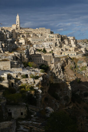 Sassi di Matera, panorama. Panorama of the Sassi of Matera with houses in tuff stone. Church and bell tower at dawn with sky and clouds. - MyVideoimage.com | Foto stock & Video footage