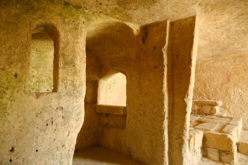 Sassi di Matera. Sassi of Matera with arched ceilings and vaults. Ancient underground house dug out of the tufa rock. - MyVideoimage.com | Foto stock & Video footage