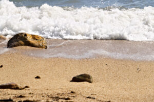 Sea waves break on the beach with stones. - MyVideoimage.com