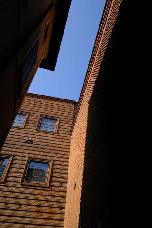 Shadow on the wall. Brick wall of a museum.  Stock photos. - MyVideoimage.com | Foto stock & Video footage