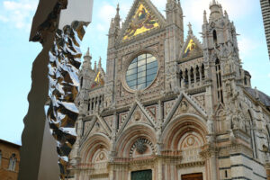 Siena Cathedral and sculpture by Helidon Xhixha. Facade Made with white and colored marble and stainless steel sculpture. - MyVideoimage.com | Foto stock & Video footage