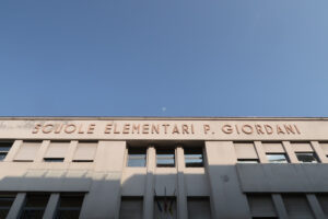 Sign of an elementary school built in the fascist period. - MyVideoimage.com