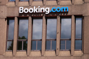 Signboard of Booking.com on the facade of a building. - MyVideoimage.com