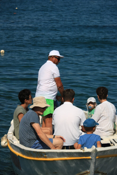 Small boat with tourists in the Mediterranean sea. Men, women an - MyVideoimage.com