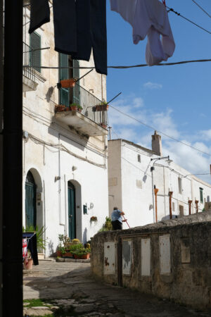 Southern Italy houses, Matera. Panorama of houses and of the Sassi of Matera with roofs and streets. Blue sky. - MyVideoimage.com | Foto stock & Video footage