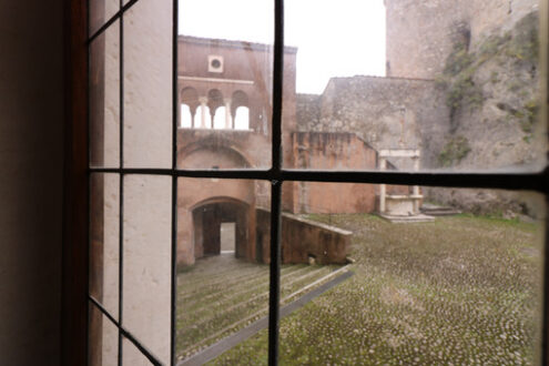 Stained glass window with a view of the courtyard of the Malaspina di Massa castle. - MyVideoimage.com