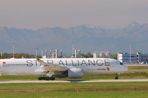 Star Alliance Lufthansa Airbus A319-100 on the Malpensa airport runway. In the background the control tower. - MyVideoimage.com