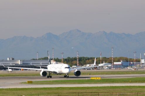 Star Alliance Lufthansa Airbus A319-100 on the Malpensa airport runway. In the background the mountains of the Alps. - MyVideoimage.com