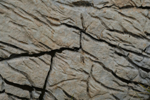 Stone eroded by water. Stone carved by water erosion on the mountain surface. Stock photos. - MyVideoimage.com | Foto stock & Video footage