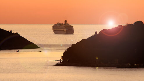 Sunset cruise. Cruise ship anchored near Portovenere and Palmaria island. Stock photos. - MyVideoimage.com | Foto stock & Video footage