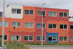 Temporary housing in steel containers. Overlapping containers - MyVideoimage.com | Foto stock & Video footage