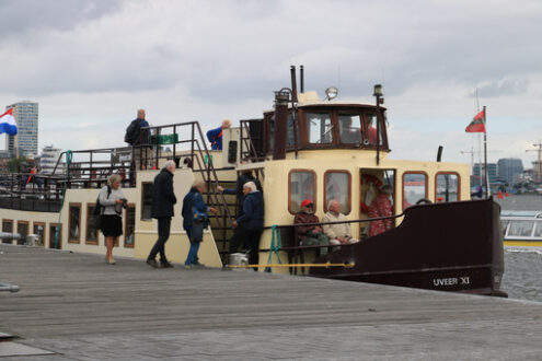 Tourist boat anchored on the Amstel river. Numerous boats allow - MyVideoimage.com