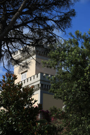 Tower of a Mediterranean villa with green park. Rich vegetation - MyVideoimage.com