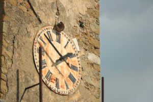 Tower with clock and bell tower in Castiglione della Pescaia. An ancient village in the Tuscan Maremma built on a hill facing the sea. - MyVideoimage.com