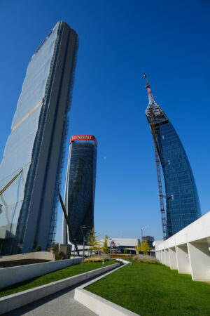 Tre torri Milano zona Citylife. Three Citylife towers designed by Isozaki, Hadid and Libeskind. Milan.CityLife includes three skyscrapers and  areas with tree and green gardens.  Company building - MyVideoimage.com | Foto stock & Video footage