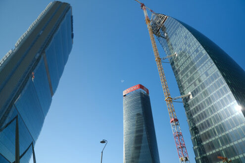 Tre torri Milano. Three Citylife towers designed by Isozaki, Hadid and Libeskind. Milan. CityLife includes three skyscrapers and  areas with tree and green gardens. - MyVideoimage.com | Foto stock & Video footage