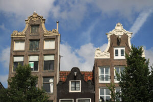 Typical Dutch houses seen from the canals of Amsterdam. Bricks f - MyVideoimage.com