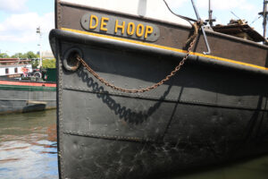 Typical transport boat anchored in the Amsterdam canals. Amsterdam foto. Amsterdam photo