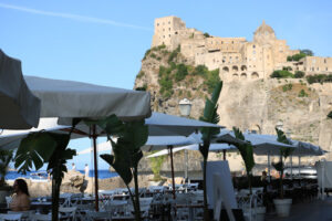 Umbrellas of a romantic seaside restaurant. In the background th - MyVideoimage.com