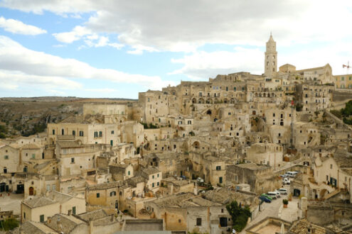 Veduta di Matera. View of the city of Matera in Italy. Church with bell tower and houses built in beige tuff stone. - MyVideoimage.com | Foto stock & Video footage