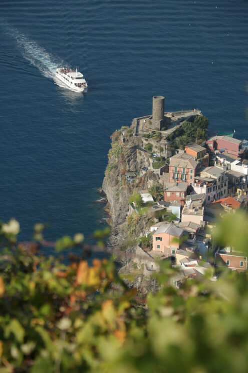 Vernazza tower. Ancient tower dominates the sea with boats. Vernazza, Cinque Terre, La Spezia, Italy. - MyVideoimage.com | Foto stock & Video footage