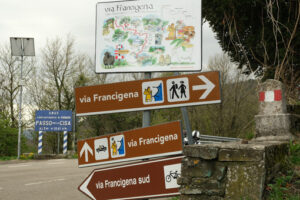 Via Francigena sign. Road signs of the Via Francigena at the Cisa Pass. Stock photos. - MyVideoimage.com | Foto stock & Video footage