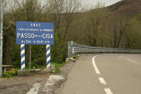 Via della Cisa. Strada Statale della Cisa with a warning sign.  Foto stock royalty free. - MyVideoimage.com | Foto stock & Video footage