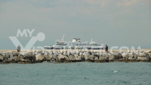 Video Procida royalty free. Ferry boat seen from the dam of the port of Procida.  Video footage. - MyVideoimage.com | Foto stock & Video footage