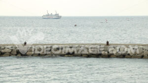 Video people ship. Ferry boat seen from the dam of the port of Procida.  Video footage. - MyVideoimage.com | Foto stock & Video footage