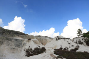 Volcanic fumaroles in the geothermal field. Jets of steam come out of the earth. Monterotondo, Larderello, Tuscany, Italy. - MyVideoimage.com