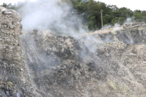 Volcanic fumaroles in the geothermal field. Jets of steam come out of the earth. Monterotondo, Larderello, Tuscany, Italy. - MyVideoimage.com