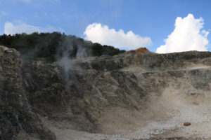 Volcanic fumaroles in the geothermal field. Jets of steam come out of the earth. Monterotondo, Larderello, Tuscany, Italy. - MyVideoimage.com