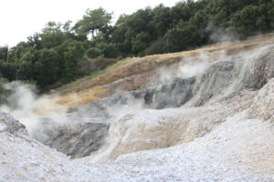 Volcanic fumaroles in the geothermal field. Jets of steam come out of the earth. Monterotondo, Larderello, Tuscany, Italy. - MyVideoimage.com