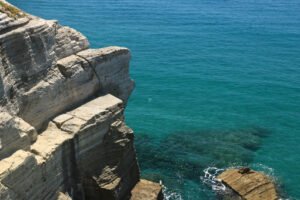 Volcanic rocks and rocks in the Mediterranean sea of Ischia. Foto Ischia photos.