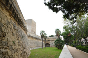 Walls of the Norman Swabian castle of Bari. The gardens with green plants and the fort built by Frederick II. Foto Bari photo.