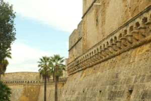 Walls of the Norman Swabian castle of Bari. The gardens with green plants and the fort built by Frederick II. Foto Bari photo.