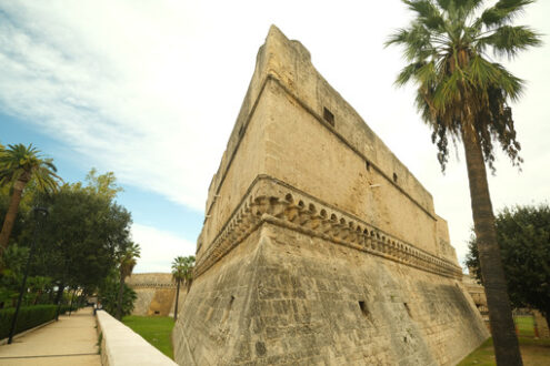 Walls of the Norman Swabian castle of Bari. The gardens with green plants and the fort built by Frederick II. Foto Bari photo.