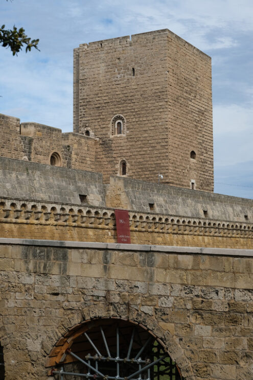 Walls of the Norman Swabian castle of Bari. The gardens with green plants and the fort built by Frederick II. Foto Bari photo.